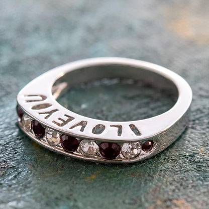 Silver tone band ring with engraved I Love You text and alternating garnet and clear Austrian crystals in channel setting