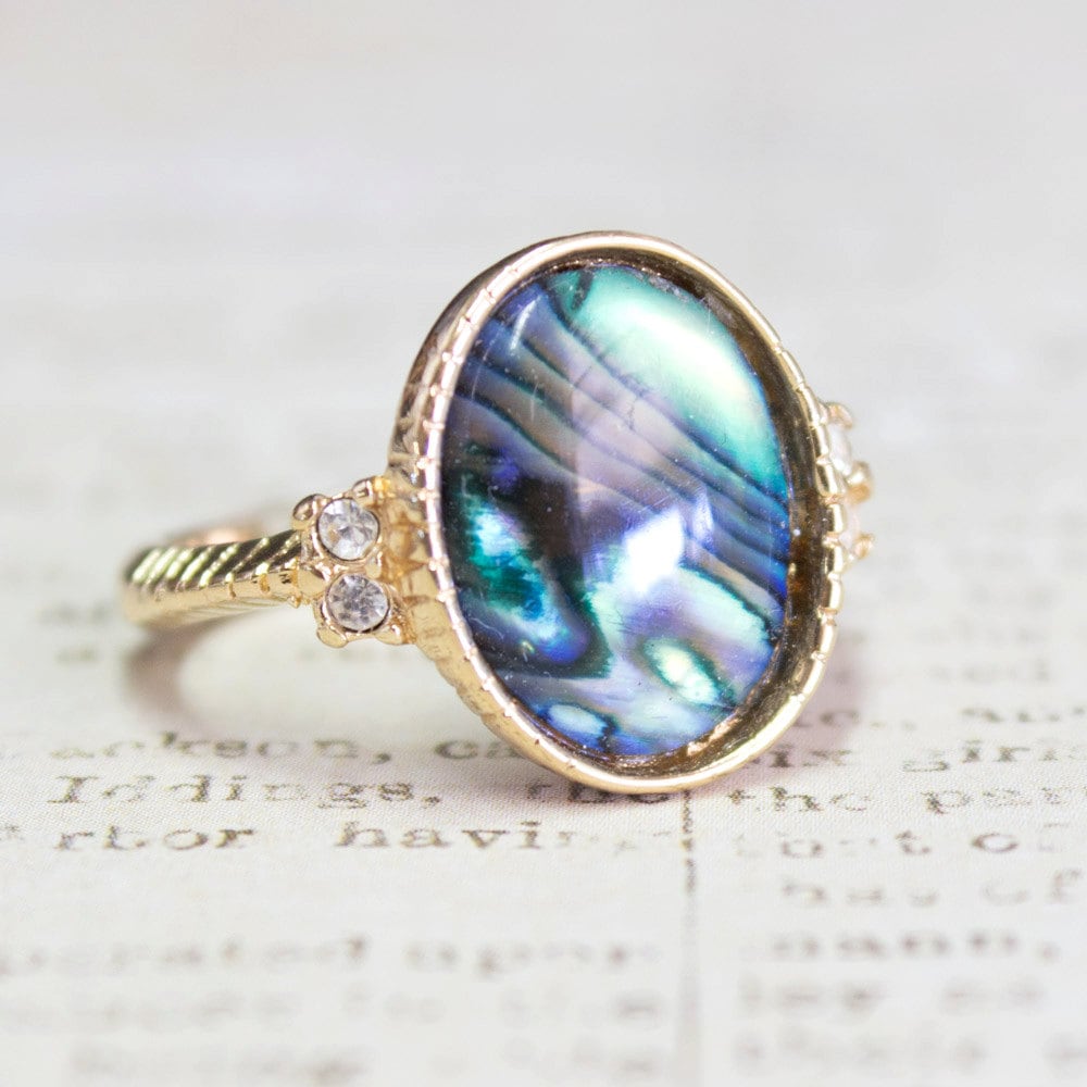 Vintage gold electroplated ring with oval blue-green abalone shell and clear Swarovski crystal accents on a twisted rope band
