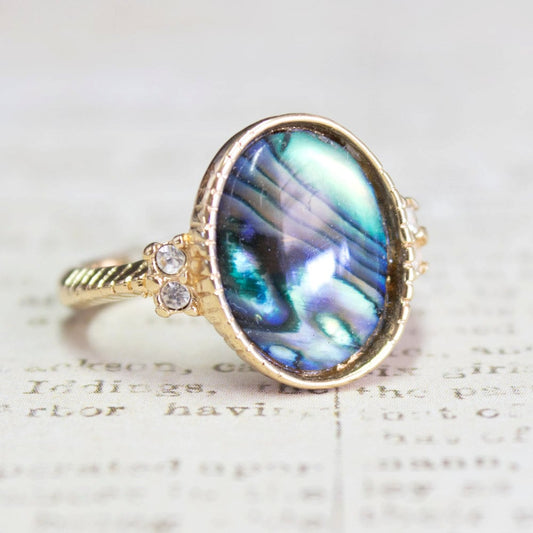 Vintage gold electroplated ring with oval blue-green abalone shell and clear Swarovski crystal accents on a twisted rope band