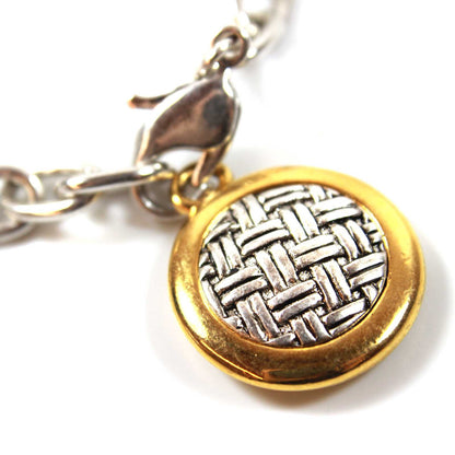 Vintage Signed Oscar De La Renta Silver Tone 7 Inch Chain Bracelet with Two Tone Round Weave Patterned Pendant